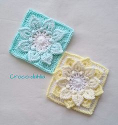 two crocheted squares with flowers on them