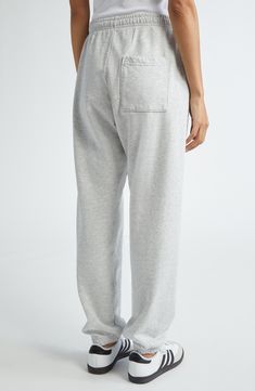 Hang out after workouts in these heathery sweatpants stamped with a monogram logo on one leg. 28" inseam; 10" leg opening; 11" front rise; 15" back rise (size X-Small) Elastic waist Side-seam pockets 97% cotton, 3% polyester Machine wash, tumble dry Made in the USA Asian & Pacific Islander Owned/Founded Athleisure Sweatpants With Relaxed Fit And Straight Hem, Sporty Long Sweatpants For Lounging, Sporty Sweatpants With Ribbed Waistband For Loungewear, Straight Leg Sweats With Comfort Waistband, Sporty Sweats With Comfort Waistband For Lounging, Relaxed Fit Straight Leg Sweats For Athleisure, Athleisure Pants With Double-needle Hem For Loungewear, Relaxed Fit Straight Leg Athleisure Sweats, Sporty Relaxed Fit Sweatpants With Ribbed Cuffs