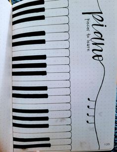 an open notebook with piano keys on it