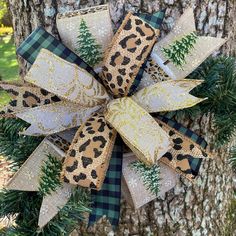 the leopard print bow is attached to a tree