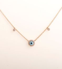 Evil eye penadant made in 14k or 18k rose gold and set with clear diamonds. Diamonds surrounding the eye and 2 additional diamonds on each side of the chain. The eye color is made in enamel coating process and can be made in other colors as well This listing is for ROSE GOLD, you can order other colours from the following links: ● Yellow gold - ● White gold - DIAMONDS SPECIFICATIONS Total Carat Weight: 0.30 CT Color: G + Clarity: VS + Shape: Round The stones are 100% natural diamonds and conflic Rose Gold Diamond Jewelry With Diamond Eyes, 14k Rose Gold Single Cut Diamonds Jewelry, 14k Rose Gold Jewelry With Diamond Eyes, Rose Gold 14k Diamond Eyes Jewelry, Elegant Rose Gold Evil Eye Jewelry, Tri Color Ring, Necklace Evil Eye, Diamonds Necklace, 18k Gold Necklace