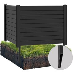 an image of a black fence with grass growing out of the top and bottom part