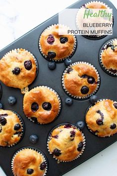 blueberry protein muffins in a muffin tin