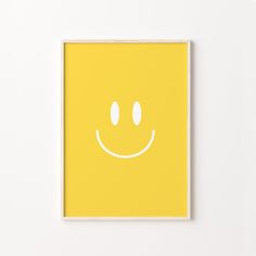 a yellow poster with a smiley face drawn on it