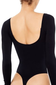 Seamless knit bodysuit featuring V - neckline, long sleeves, open back, and thong cut. | Shell: 93% nylon, 7% spandex | Lining: 100% polyester | Machine wash cold | Model is 5'9" and wearing Small | Seamless Open - Back Thong Bodysuit Long Sleeve Stretch Bodysuit With Smoothing Details, Long Sleeve Second-skin Smoothing Bodysuit, High Stretch Elastane Backless Bodysuit, Seamless Second-skin Long Sleeve Bodysuit, Solid Seamless Long Sleeve Bodysuit, Solid Long Sleeve Seamless Bodysuit, High Stretch Seamless Long Sleeve Bodysuit, Seamless High Stretch Long Sleeve Bodysuit, Seamless Long Sleeve High Stretch Bodysuit