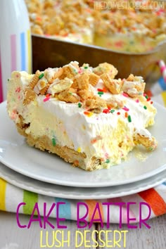 a piece of cake sitting on top of a white plate next to a container of milk