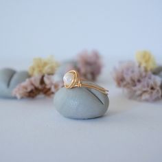 Connect to your inner Goddess with the energies of this uniquely crafted pearl ring. Our pearl ring is known for: HANDMADE ORIGINAL DESIGN - We customize each pearl ring to the unique shape of its stone. Our ring has an easy to wear, stackable design. Tailor it to fit your moos and style. AUTHENTIC PEARLS & ALLERGY FREE MATERIALS - Your freshwater pearl is authentic and natural. We only use high quality nickel-free, lead-free and allergy-free materials. Ring Specifics: SIZE & MATERIAL - Size of the pearl is 3.5-4 mm. Ring is available in sizes 5 through 11 and in 2 different metal materials: gold plated copper and 14k gold-filled. FEEL THE VIBE OF THE PEARL - Pearl signifies innocence and faith and is bringing calming effect. Pearl is June's Birthstone and great for Gemini and Cancer zodia Minimalist Adjustable Ring With Pearl Drop, Minimalist Adjustable Rings With Pearl Drop, Minimalist Pearl Drop Rings As Gift, Minimalist Adjustable Pearl Drop Rings, Minimalist Pearl Drop Ring For Gift, Minimalist Pearl Ring With Birthstone, Minimalist Pearl Rings As A Gift, Minimalist Pearl Drop Ring For Promise, Dainty White Pearl Ring With Gemstone