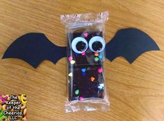 a bat shaped phone case with sprinkles on it