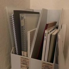 an open file cabinet filled with files and folders