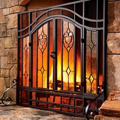 a fire place sitting next to a stone wall