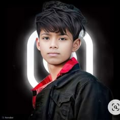 a young boy is standing in front of a black background with the letter q on it