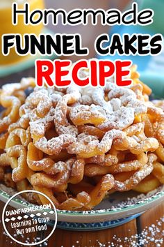 homemade funnel cakes recipe on a plate with powdered sugar and orange juice in the background