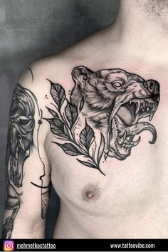 a man's chest with a tattoo on it that has a tiger head and leaves