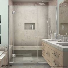 a bathroom with two sinks, a shower and a bathtub next to each other