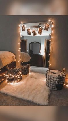 a bedroom with lights strung from the ceiling, and a rug on the floor in front of it