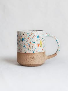 a coffee mug with sprinkles on it