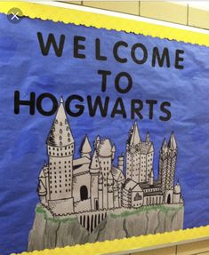 a welcome to hogwarts sign hanging on a wall in a school hallway,