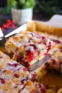 a close up of a piece of cake being lifted from a pan