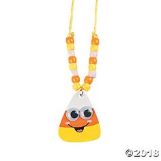 an orange and white necklace with a yellow bead on the bottom, featuring a cartoon character