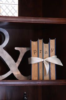 a book shelf with books and decorative letters