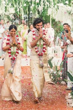 the bride and groom are walking down the aisle