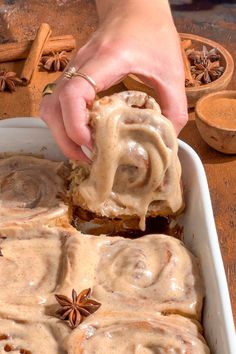 cinnamon rolls with icing in a baking dish