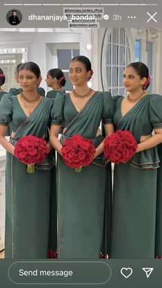 the bridesmaids are wearing green dresses with red flowers in their bouquets and holding roses