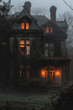 an old house is lit up at night