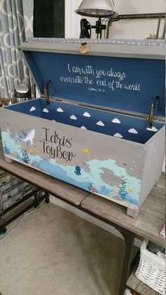 a large blue box sitting on top of a wooden table