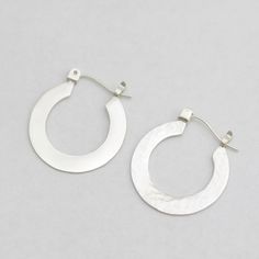 Sterling Silver Earrings With Silver Clasp, Sterling Silver Polished Earrings For Everyday, Sterling Silver Earrings With Polished Finish For Everyday, Pierced Sterling Silver Hoop Earrings, White Gold Sterling Silver Hoop Earrings, White Gold Sterling Silver Hoop Earrings For Pierced Ears, White Sterling Silver Hoop Earrings For Anniversary, Sterling Silver White Gold Hoop Earrings, Modern Silver Hoop Earrings With Sterling Clasp