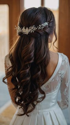 the back of a woman's head wearing a wedding hair comb