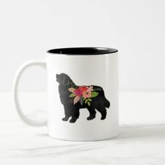 a black and white dog with flowers on it's back two - tone coffee mug