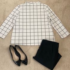 Chic Black & White Windowpane Pattern Blouse With Mock Turtleneck, 3/4 Sleeves And Back Zipper By Melloday. Perfect For Work! Approx Measurements (Taken Laid Flat) 23” Length 21” Armpit To Armpit 20” Sleeve Length 7” Zipper Reasonable Offers Welcome! Message Me With Any Questions! Bundle & Save $ Smoke Free Home Ships 1-2 Biz Days Chic Tops With 3/4 Sleeves For Work, Fall Long Sleeve Tops With Grid Pattern, Chic 3/4 Sleeve Blouse For Work, White Business Casual Tops For Fall, Business Casual White Tops For Fall, Chic Plaid Tops For Office, Plaid Long Sleeve Blouse For Office, Plaid Long Sleeve Tops For Office, Elegant Plaid Long Sleeve Tops