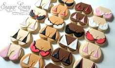 many decorated cookies are arranged in the shape of women's bras and panties