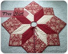 a red and white quilted table topper with the words free spirit on it