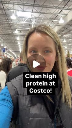 a woman is taking a selfie with her cell phone at costco's store