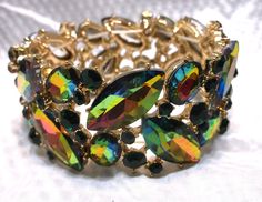 "Multi Color Crystal Marquis Stretch Statement Bracelet, Beautiful Bright and Shiny Measures approx 2 1/2 \" around and 1 1/2 \" High" Multicolor Jewel Bracelets For Party, Multicolor Round Stretch Bracelet For Party, Green Cuff Bracelet For Party, Elegant Multicolor Stretch Bracelet For Party, Party Multicolor Round Stretch Bracelet, Statement Bracelet, Color Crystal, Arm Band, Jewelry Bracelets