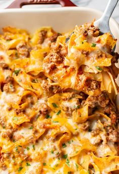 a casserole dish with meat and cheese in it, ready to be eaten