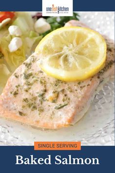 a plate with salmon, salad and lemon on it is featured in the one dish kitchen cookbook