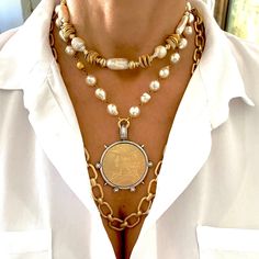 If you're looking for a Spectacular Statement Necklace, look no further….🌟 Large reproduction French coin in matte gold set in decorative silver bezel. We've done a few variations of this design, it's been one of our best sellers. This beauty hangs from a gold beaded vintage style glass pearl chain with lobster clasp which can be adjusted to wear up to 20” in length. Need it longer? Just choose your length from our drop down menu! Chain and clasp are brass based with gold electroplate and a pro Large Necklaces, French Face, Chunky Gold Jewelry, Large Pearl Necklace, Chunky Gold Necklaces, French Coins, Classic Pearl Necklace, Bijoux Art Nouveau, Pearl Necklace Designs