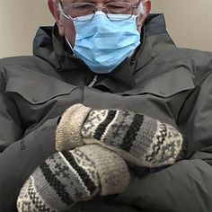 a man wearing a face mask and gloves