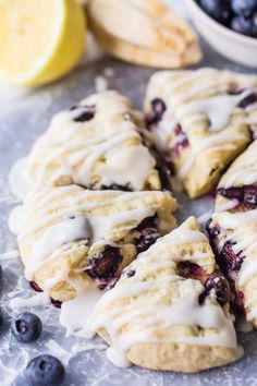 lemon blueberry scones with icing on a table