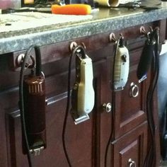 an old fashioned stove with several phones hanging on it's sides and cords attached to the back