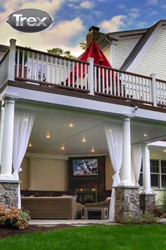 a large house with white pillars and curtains on the front porch is featured in an advertisement for trex