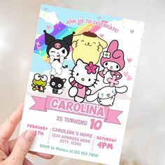 a person holding up a card with some cartoon characters on it and the words carolina is turning 10