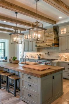 a kitchen with an island and wooden floors