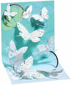 a pop up card with white butterflies on it