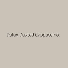 the words dulux dusted cappuccino on a gray background