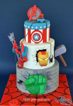 a three tiered cake decorated like the avengers