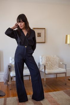 The Darby is our best-selling high-waisted, flared stretch denim pant with front patch pockets and a pintuck stitched down front of each leg. With a subtle 70's svelte silhouette, Darby fits the figure beautifully. Pairs perfectly with slouchy sweaters, fitted blazers, or a simple tee or silk camisole. Erica Tanov This garment is made of a raw denim that has been left in its pure, untreated state. To avoid dye transfer, we recommend an initial separate cold water wash and line dry, which will result in slight shrinkage. Thereafter, please dry clean to maintain the fit and original dark wash we love. Details Made in USA. 59% Cotton, 20% Rayon, 13% Modal, 6% Polyster, 2% Lycra. Dry clean only. We recommend an initial separate cold water wash–as dye may bleed–and line dry. Thereafter, dry cle Dark Denim Pants Outfit, Dark Flare Jeans Outfit, Navy Pants Outfit, Erica Tanov, Palazzo Pants Outfit, Flare Jeans Outfit, Teaching Outfits, Jeans Outfit Women, Denim Suit